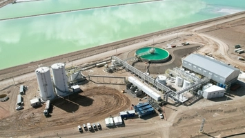 Aerial view of a lithium brine processing facility with large evaporation ponds and industrial infrastructure